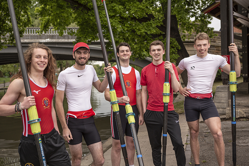 Members of the LMBC men's rowing crews by the River Cam